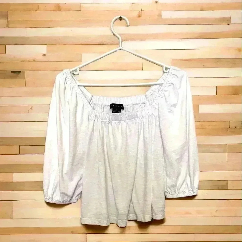 Sanctuary cropped, off shoulder, 100% cotton top with elasticized 3/4 sleeves.